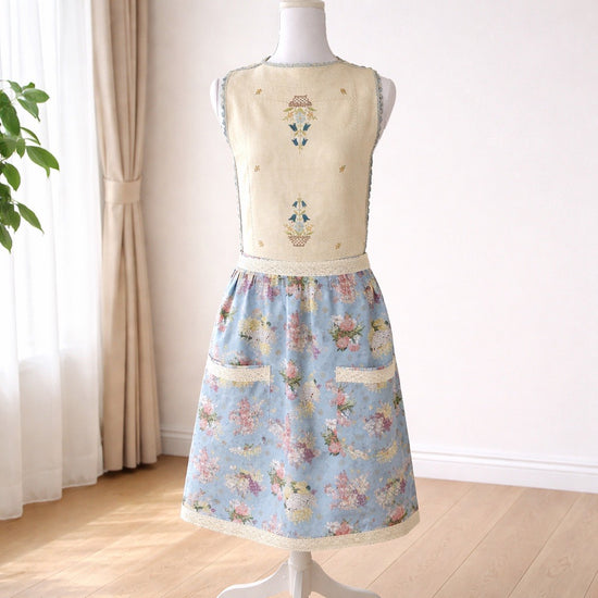 Adult apron made from vintage table linens and a light blue floral fabric