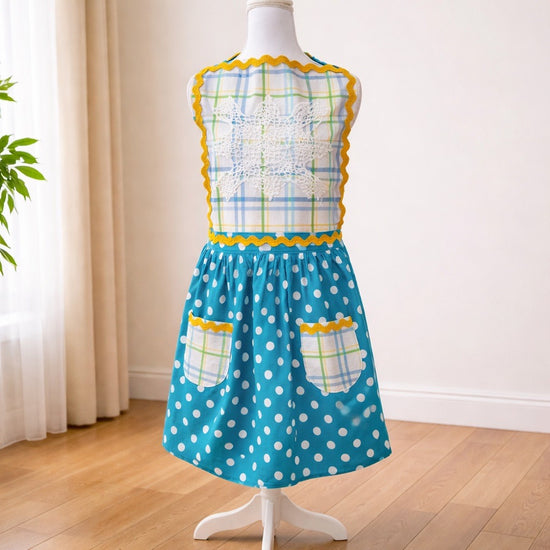 Adult apron made with vintage table linens and paired with a bright teal polka dot fabric