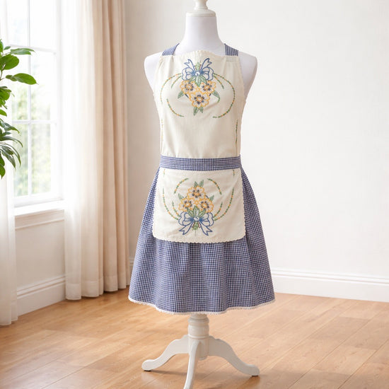 Adult apron made from vintage table lines and paired with a fun plaid fabric