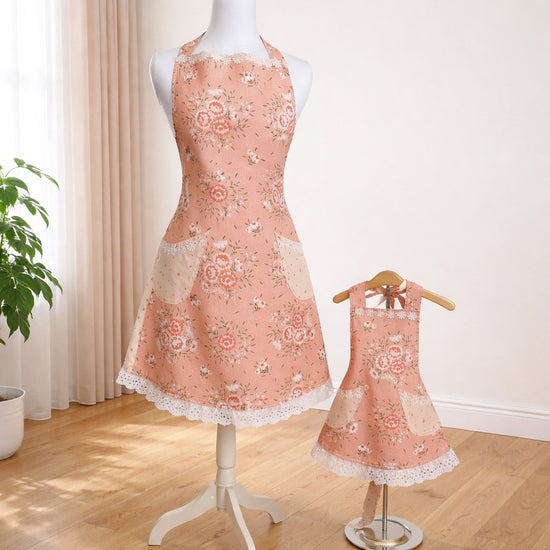Adult size apron in soft peach floral fabric with white trim