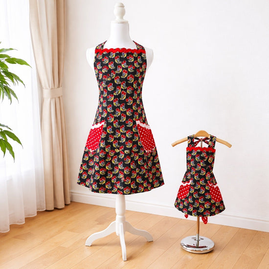 Adult apron made from a fun cherry pattern fabric and trimmed in white