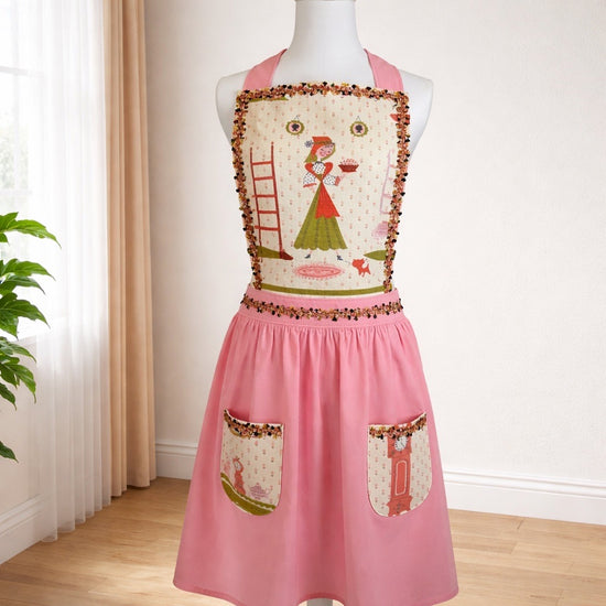 Adult apron made from vintage table lines and paired with a light pink fabric