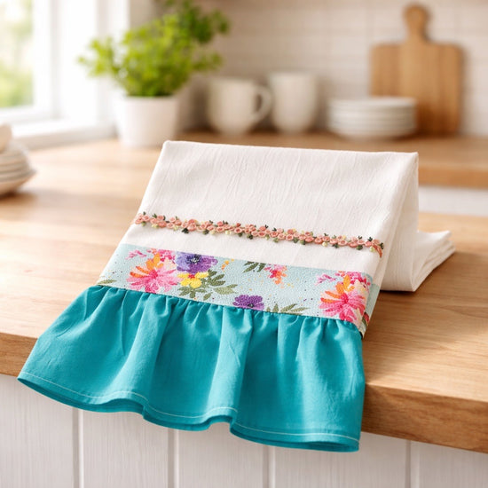 Flour sack kitchen towel with floral and teal accents